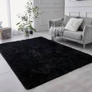 DESCRIPTION: (1) AREA RUG BRAND/MODEL: MAINSTAYS INFORMATION: SHAG, BLACK SIZE: 7' X 10' RETAIL$: $119.00 EA QTY: 1