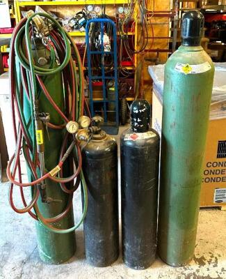 DESCRIPTION: OXYGEN ACETYLENE WELDING TANK PACKAGE WITH (2) FULL TANKS AND (2) PARTIAL TANKS, HOSE, AND TORCH QTY: 1