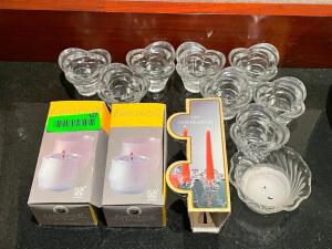 LARGE GROUP OF CANDLES AND CANDLE HOLDERS