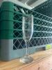 DESCRIPTION (36) CHAMPAGNE FLUTES ADDITIONAL INFORMATION W/ GLASS RACK THIS LOT IS: SOLD BY THE PIECE LOCATION STORAGE CONTAINER QTY 36 - 3