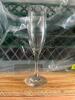 DESCRIPTION (36) CHAMPAGNE FLUTES ADDITIONAL INFORMATION W/ GLASS RACK THIS LOT IS: SOLD BY THE PIECE LOCATION STORAGE CONTAINER QTY 36 - 2