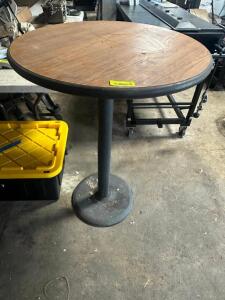 DESCRIPTION 24" LAMINATE WOOD TOP PUB TABLE SIZE 24" R X 42" T LOCATION SITE 2 QTY 1