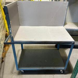 TWO TIER METAL UTILITY CART W/ BACK AND SIDE PANELS.