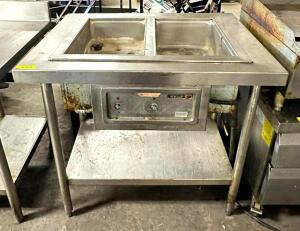 DESCRIPTION: 2-WELL ELECTRIC STEAM TABLE BRAND/MODEL: WELLS MOD-2003 SIZE: 37" QTY: 1