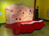 10' HAIR GROWTH ROCK WALL INTERACTIVE EXHIBIT WITH PADDED FLOOR