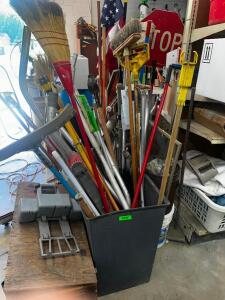 DESCRIPTION TRASH CAN W/ CONTENTS - ASSORTED LONG HANDLES. THIS LOT IS: ONE MONEY QTY 1