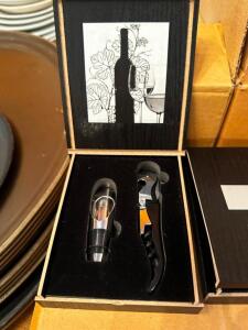 DESCRIPTION (1) CASE OF LORUSSO'S BOTTLE OPENER AND CORK COLLECTIBLE SETS. LOCATION ROOM 3 QTY 1