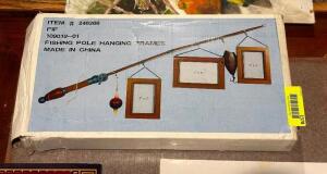 DESCRIPTION: FISHING POLE HANGING FRAME LOCATION: ROOM 3 THIS LOT IS: ONE MONEY QTY: 1