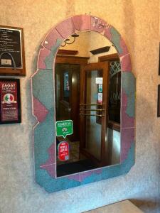 DESCRIPTION: 4 FT. DECORATIVE MIRROR LOCATION: ENTRANCE THIS LOT IS: ONE MONEY QTY: 1