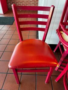 DESCRIPTION (8) LADDER BACK METAL CHAIRS W/ RED CUSHION SEATS ADDITIONAL INFORMATION SEATS ALL HAVE WEAR AND TEAR. LOCATION COUNTER QTY 8