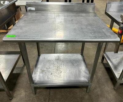 STAINLESS STEEL TABLE WITH BACKSPLASH AND STAINLESS UNDERSHELF