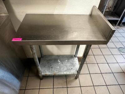 DESCRIPTION 30" X 18" STAINLESS TABLE W/ 4" BACK SPLASH SIZE 30" X 18" LOCATION KITCHEN QTY 1