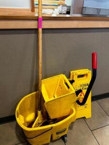 DESCRIPTION MOP BUCKET AND WRINGER/ ADDITIONAL INFORMATION W/ MOP AND (2) WET FLOOR SIGNS LOCATION FRONT QTY 1