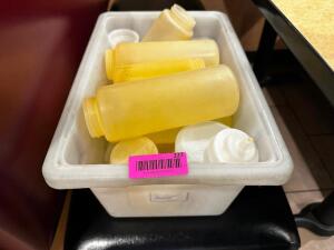 DESCRIPTION TUB AND CONTENTS - ASSORTED PLASTIC SQUEEZE BOTTLES AND LIDS THIS LOT IT: ONE MONEY LOCATION FRONT QTY 1