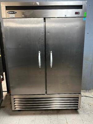 KOOL-IT TWO DOOR REACH IN FREEZER W/ TRAY RACK INSERTS.