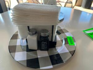 (10) PLASTIC CHARGERS W/ SALT AND PEPPER SHAKERS AND NAPKIN HOLDERS.