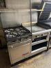 FRANKLIN CHEF FOUR BURNER RANGE W/ 24" GRIDDLE.