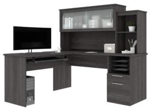 DESCRIPTION: (1) PEDESTAL CABANA COMPUTER DESK BRAND/MODEL: BESTAR/88420-47 INFORMATION: BARK GRAY/L-SHAPED RETAIL$: 721.99 SIZE: 62.8"H X 22"D X 130"