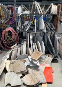 ASSORTED CONCRETE SAW BLADE COVERS WITH RACK