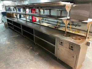 DESCRIPTION: 20' STAINLESS CHEFS LINE W/ RISER SHELF, (4) APW WARMERS, AND (2) WELLS HEATED DROP INS. SIZE: 20' LOCATION: KITCHEN QTY: 1