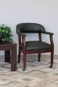 DESCRIPTION: BLACK AND MAHOGANY FAUX LEATHER GUEST OFFICE CHAIR BRAND/MODEL: BOSS RETAIL$: $124.94 LOCATION: WAREHOUSE QTY: 1