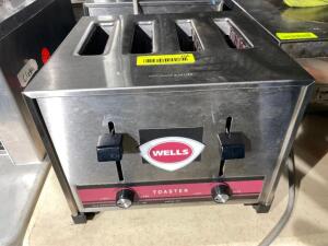 DESCRIPTION: WELLS FOUR GROUP COMMERCIAL TOASTER. BRAND / MODEL: WELLS T-4C ADDITIONAL INFORMATION 208 VOLT, 12 AMP LOCATION: BAY 7 QTY: 1