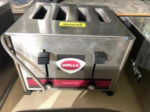 DESCRIPTION: WELLS FOUR GROUP COMMERCIAL TOASTER. BRAND / MODEL: WELLS T-4C ADDITIONAL INFORMATION 208 VOLT, 12 AMP LOCATION: BAY 7 QTY: 1