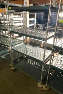 DESCRIPTION: 36" X 24" FOUR TIER METAL RACK. ON CASTERS SIZE: 36" X 24" X 72" LOCATION: BAY 7 QTY: 1