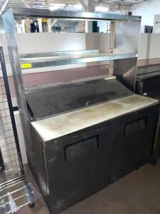 DESCRIPTION: TRUE 48" REFRIGERATED PREP TOP W/ RISER SHELF. BRAND / MODEL: TRUE TSSU-48-12 ADDITIONAL INFORMATION POWERS ON, SELLER INDICATES SLOW LEA