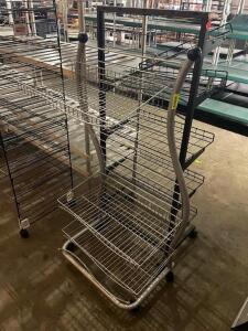 DESCRIPTION: (2) 24" ROLL ABOUT WIRE FLOOR DISPLAY RACKS LOCATION: BAY 7 THIS LOT IS: ONE MONEY QTY: 1