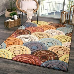 DESCRIPTION: BRIGHT DOTTED CIRCLES INDOOR AREA RUG BRAND/MODEL: BETTER HOMES & GARDENS RETAIL$: $87.34 SIZE: 5'X7' QTY: 1