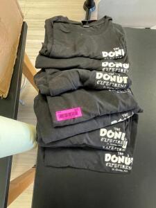 (7) ASSORTED BLACK DONUT SHOP T-SHIRTS.